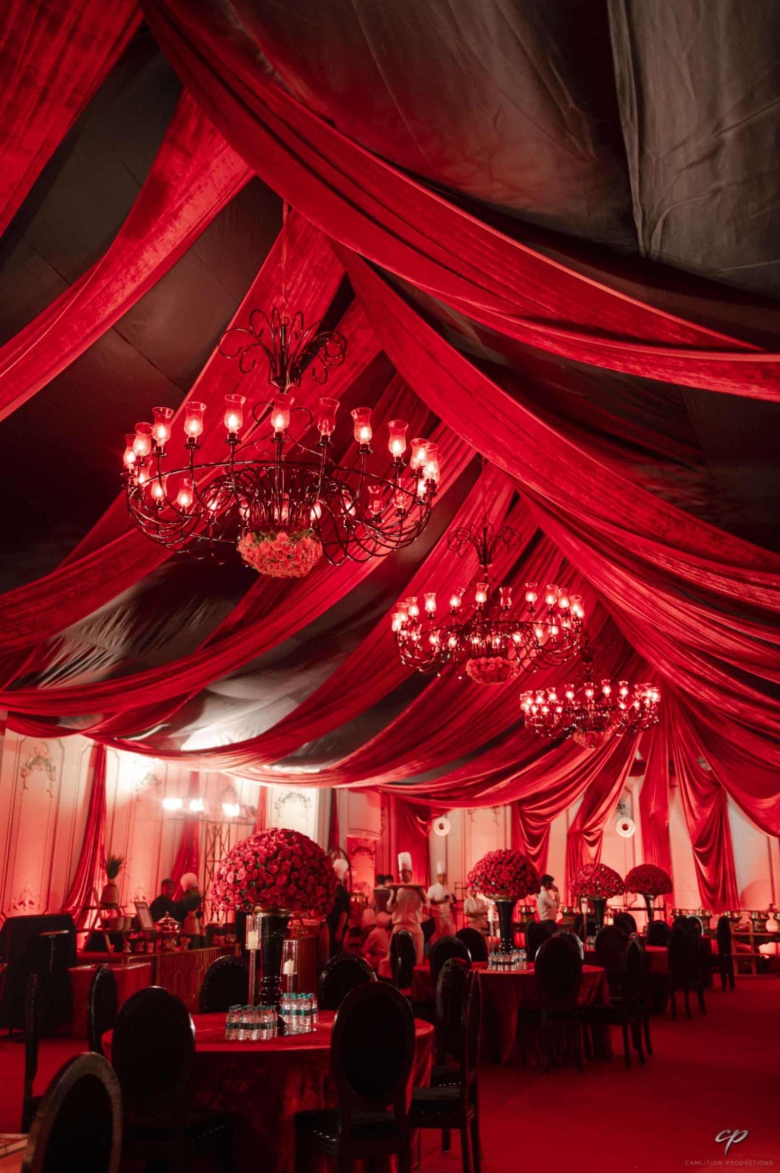 Candlelit red-draped reception hall styled by Shaadi Shenanigans