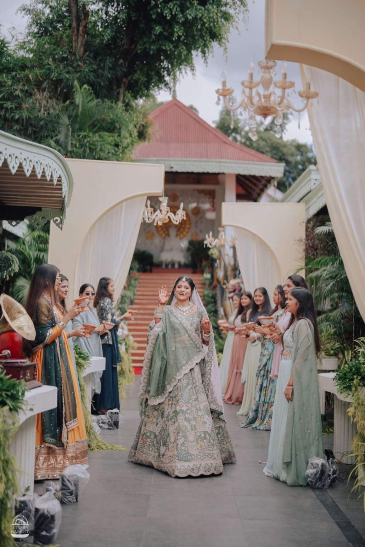 Bride walking the aisle with bridesmaids showering flower petals at a Shaadi Shenanigans wedding